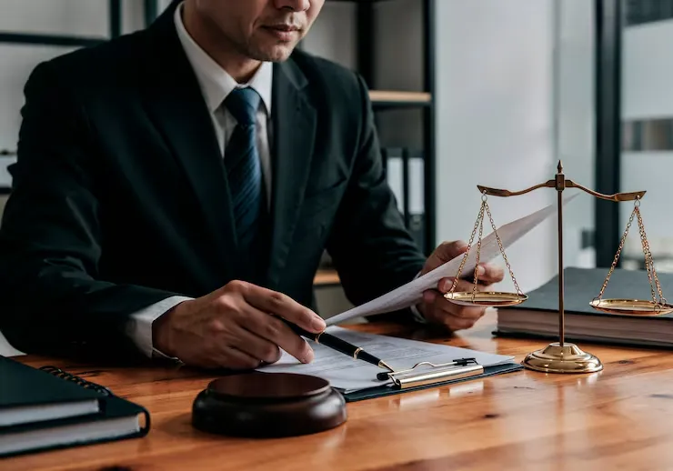 imgi_11_lawyer-working-document-with-scales-justice_23-2151962523